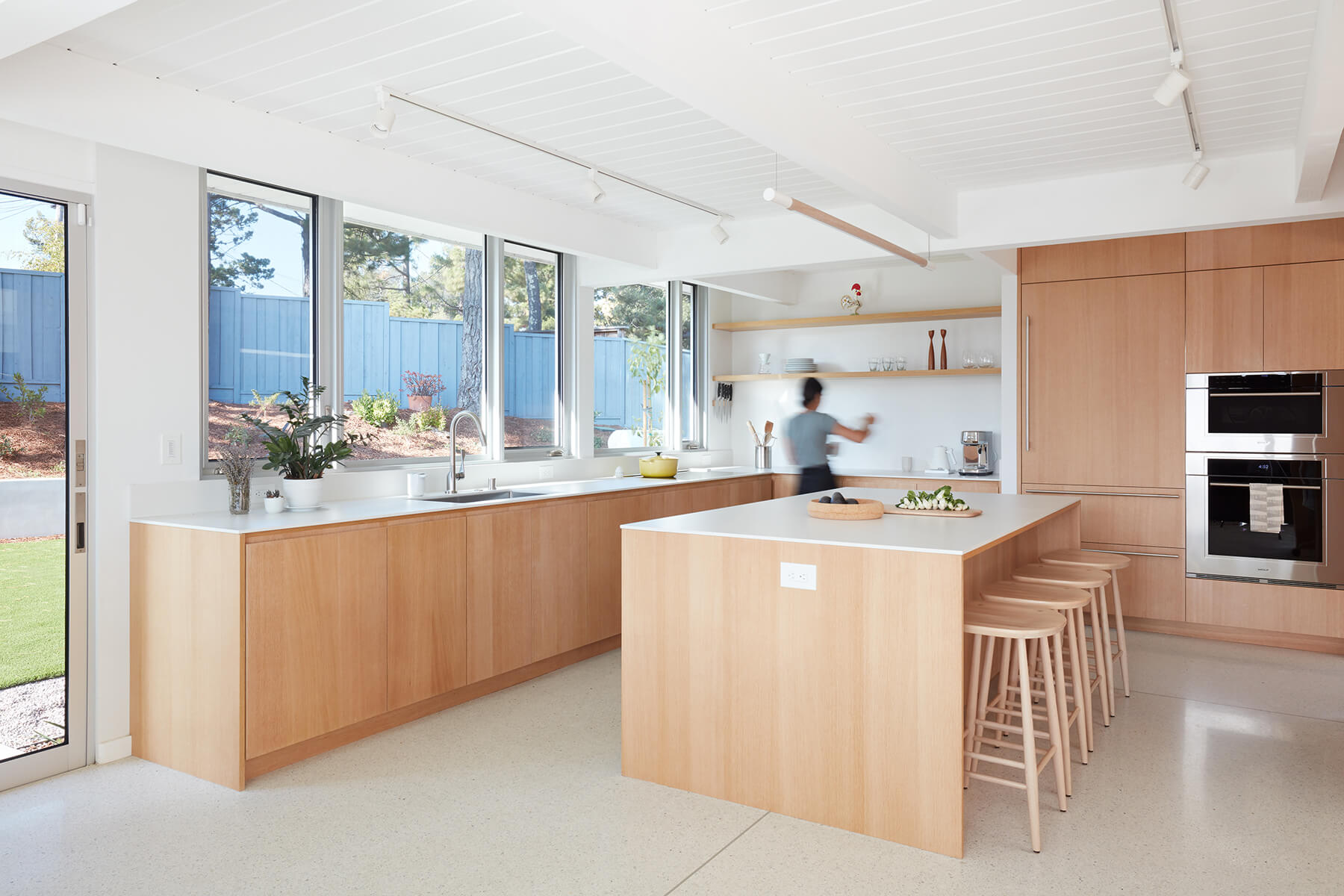 Eicherl renovation kitchen with custom wood cabinetry and Dekton surfaces.