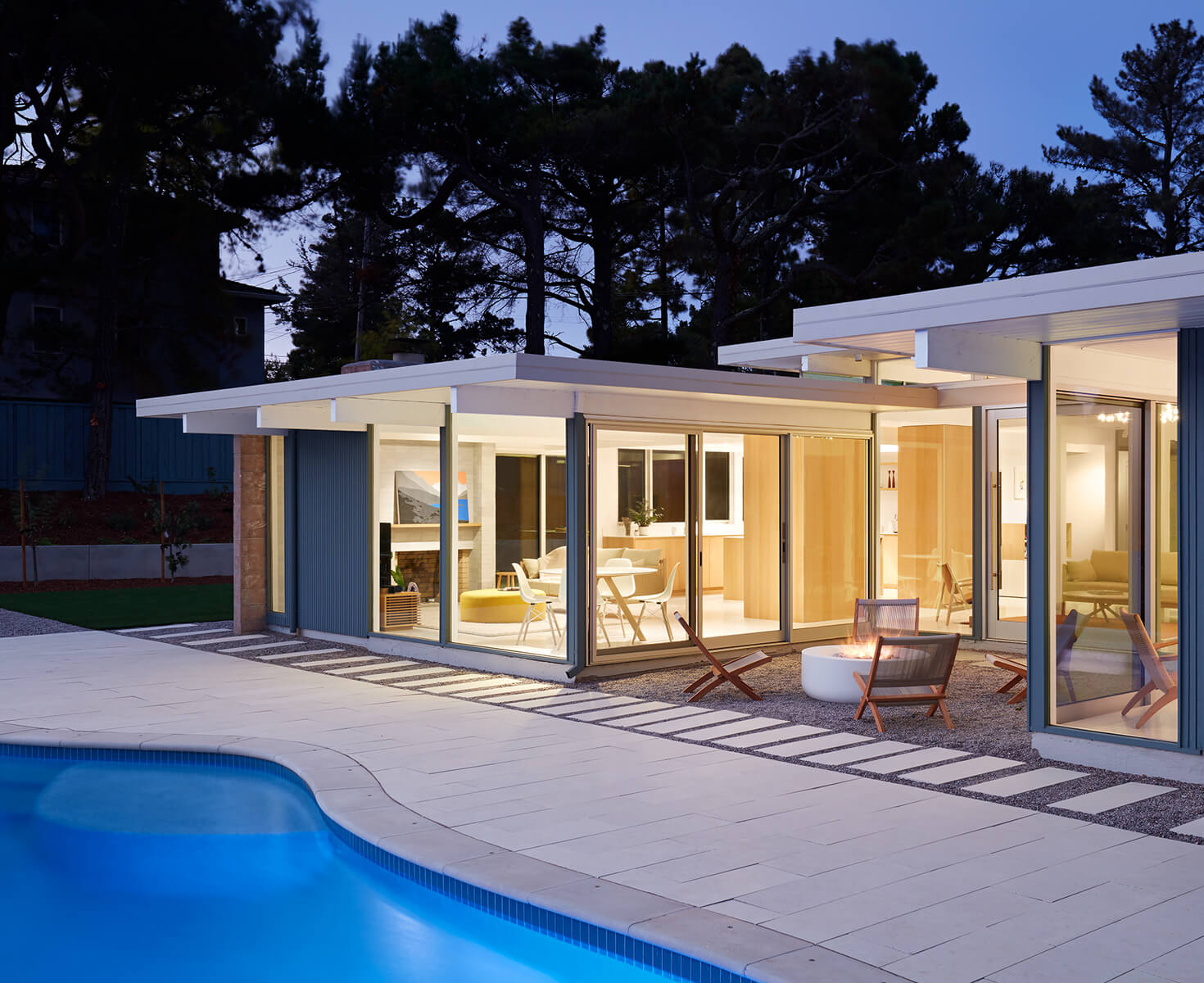 Eichler renovation view to family room over fire feature.